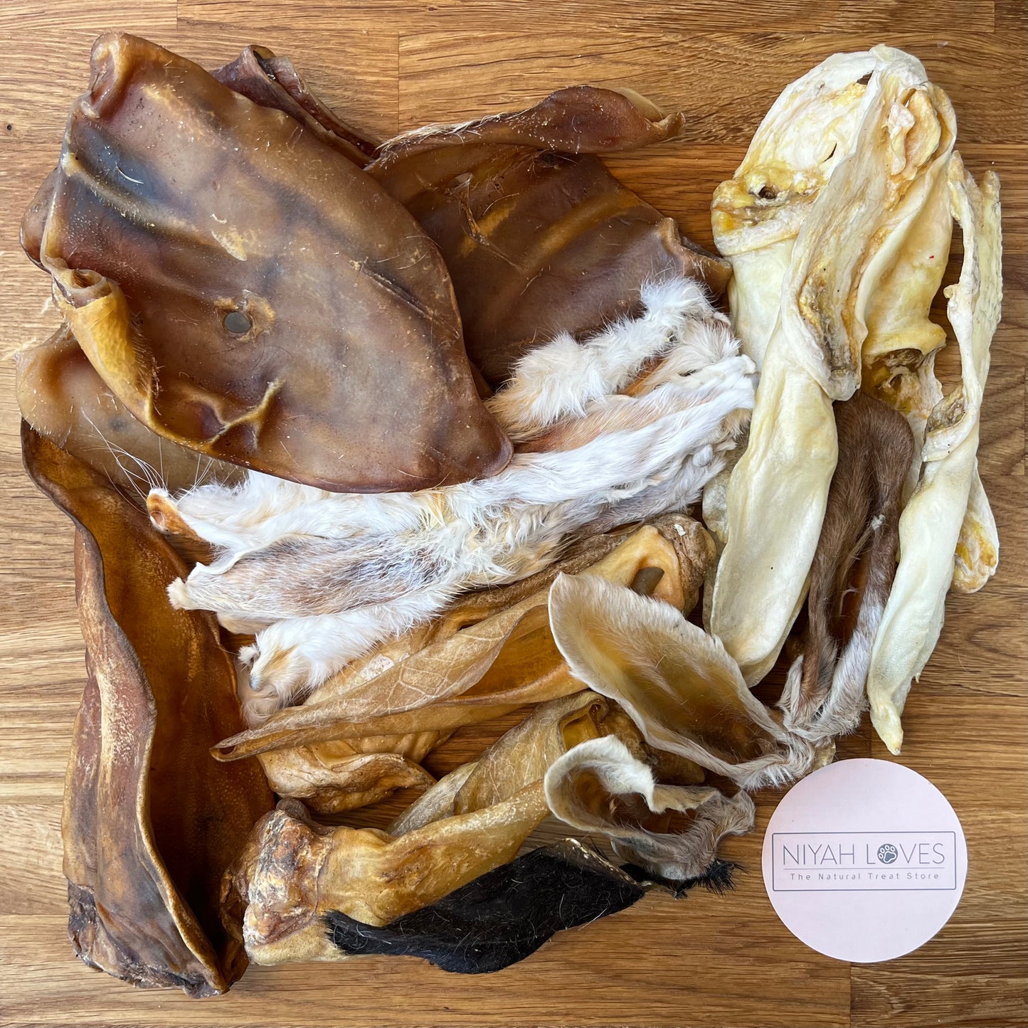 "Mixed box of natural dog ears – variety pack including goat, rabbit, lamb, pig, and cow ears"